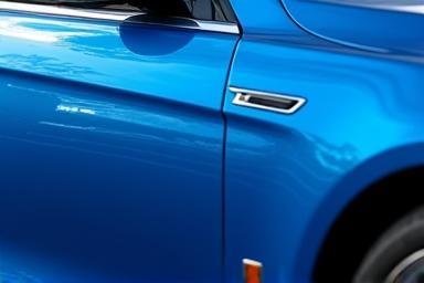 Detailed exterior view of a clean blue sedan.